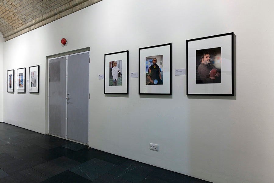 Art gallery with framed photographs on a white wall